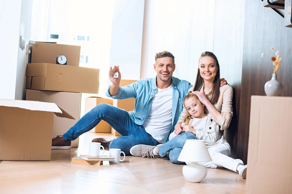 Happy family with their new home